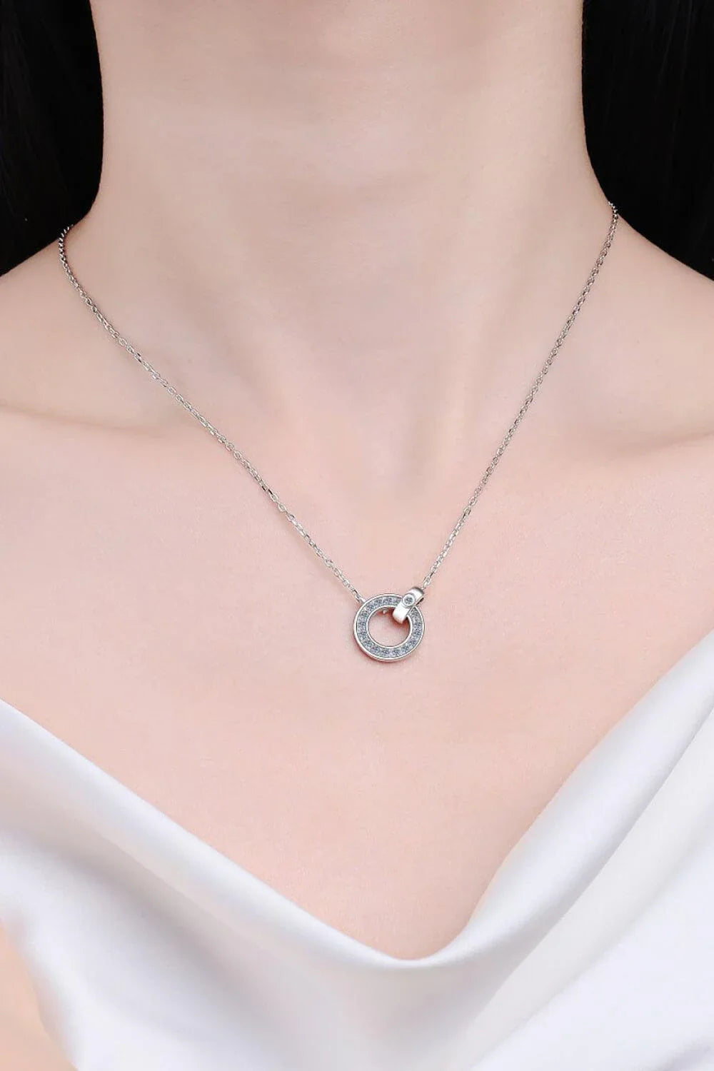 Elegant moissanite and sterling silver necklace with a minimalist, contemporary design