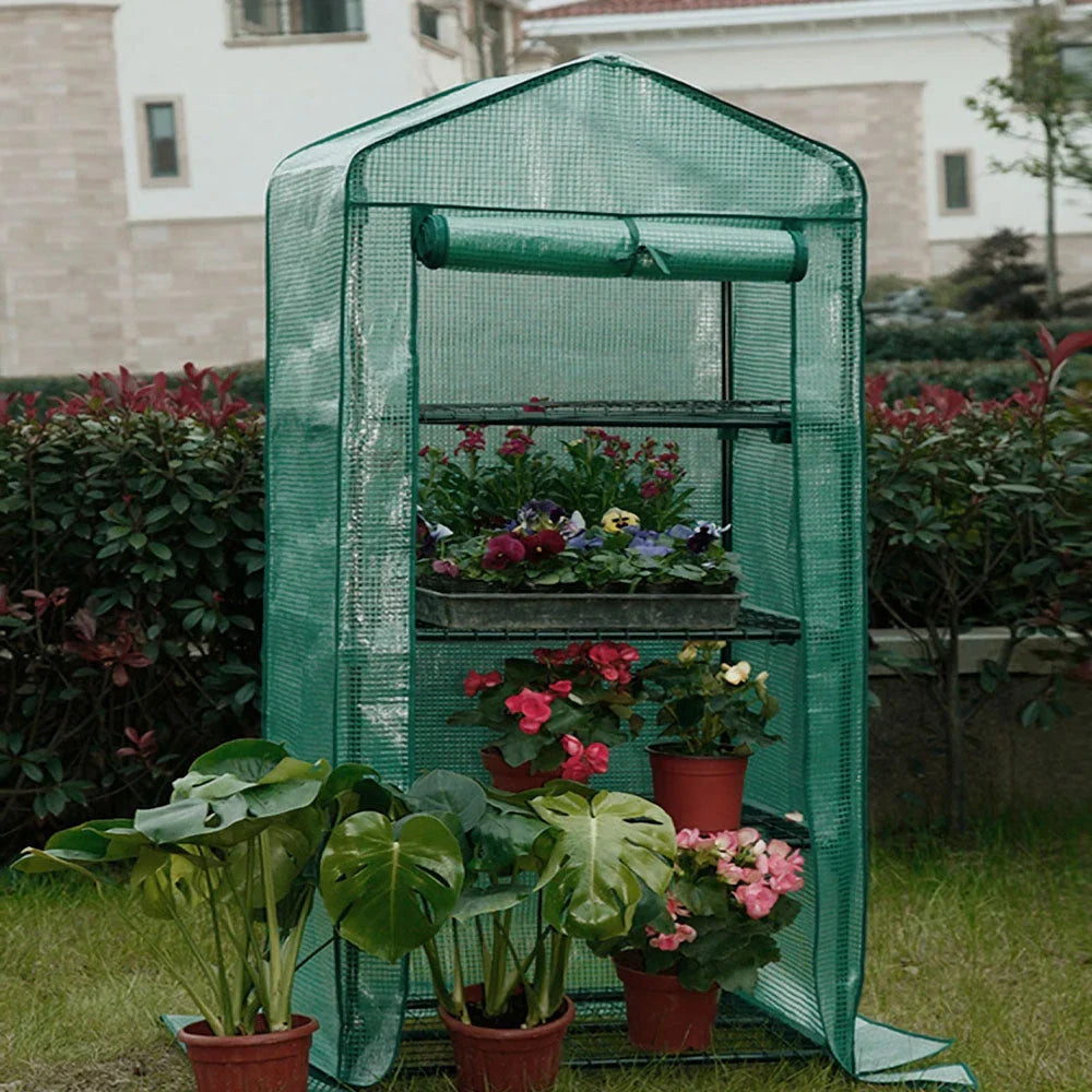 Compact 4-Tier Mini Greenhouse Cover with roll-up zipper door for growing plants in limited outdoor spaces