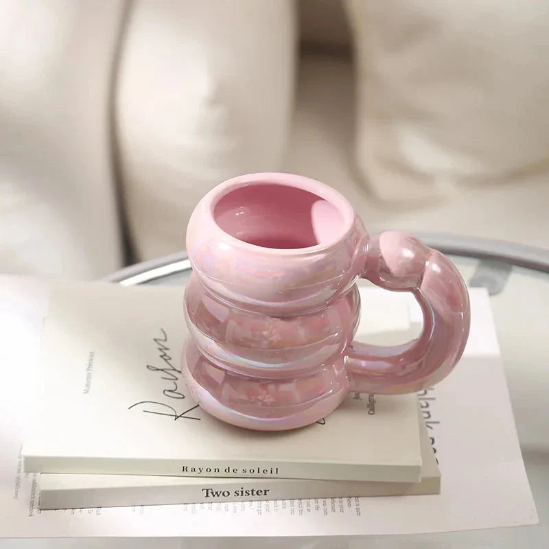 Charming ceramic coffee mug with a circular bubble design in a light blue colour, perfect for morning beverages in the UK