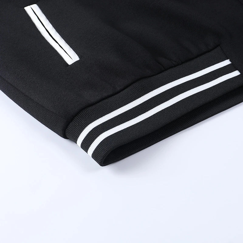 A classic British-style baseball jacket with contrast PU stitching, showcasing a sophisticated and versatile design for casual wear.