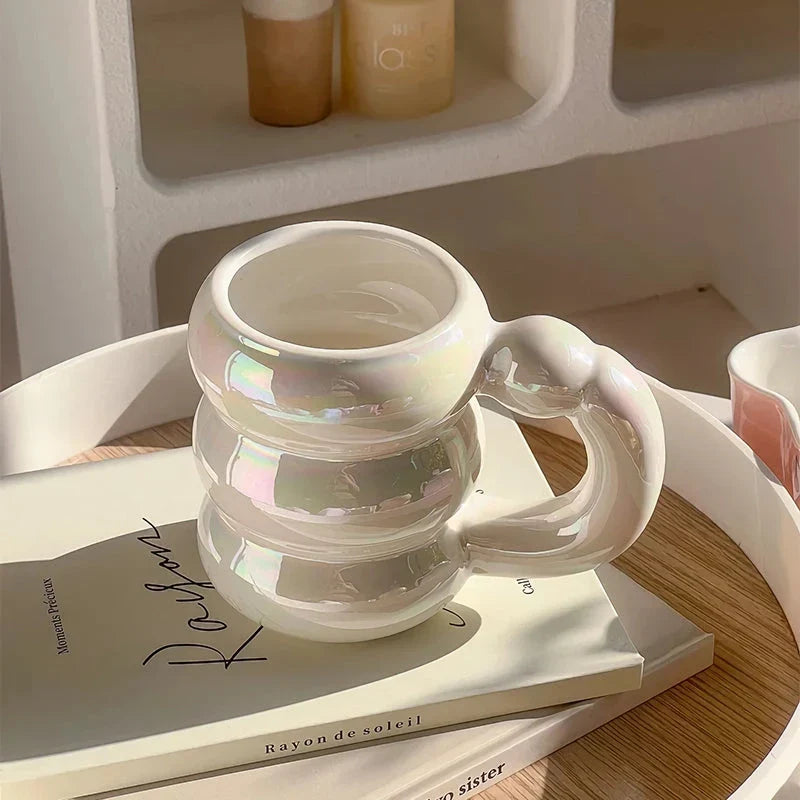 Charming ceramic coffee mug with a circular bubble design in a light blue colour, perfect for morning beverages in the UK