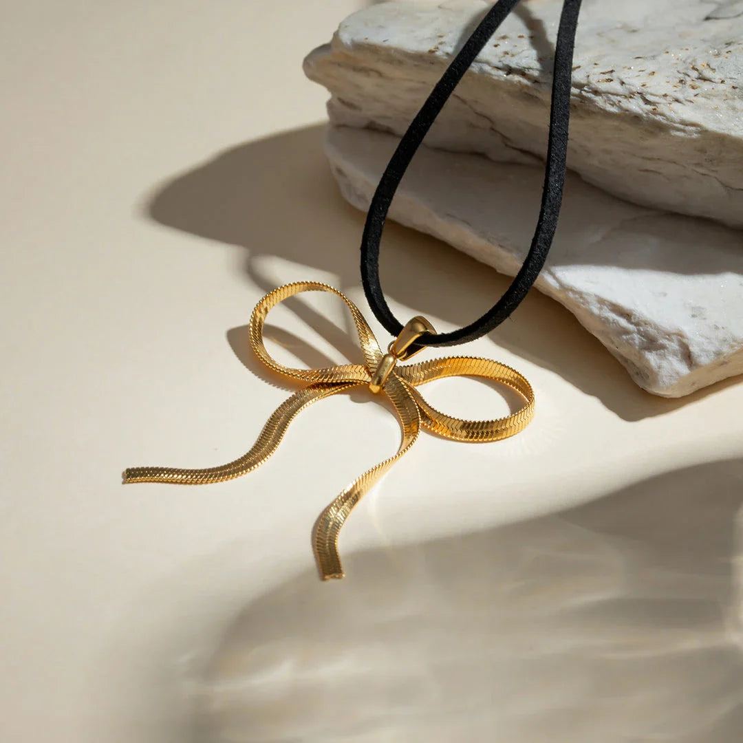 18K gold plated bowknot snake bone chain necklace with a sleek, elegant design