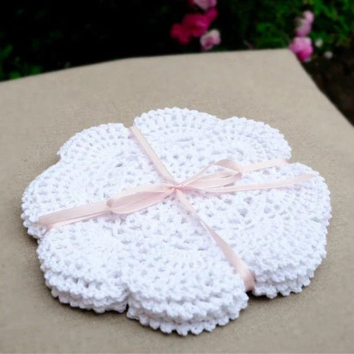 Handcrafted crochet placemats in various classic colours, showcasing the timeless elegance of British craftsmanship