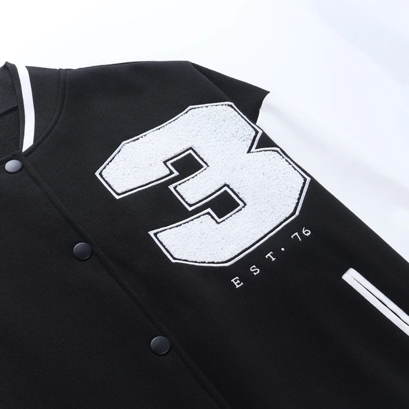 A classic British-style baseball jacket with contrast PU stitching, showcasing a sophisticated and versatile design for casual wear.