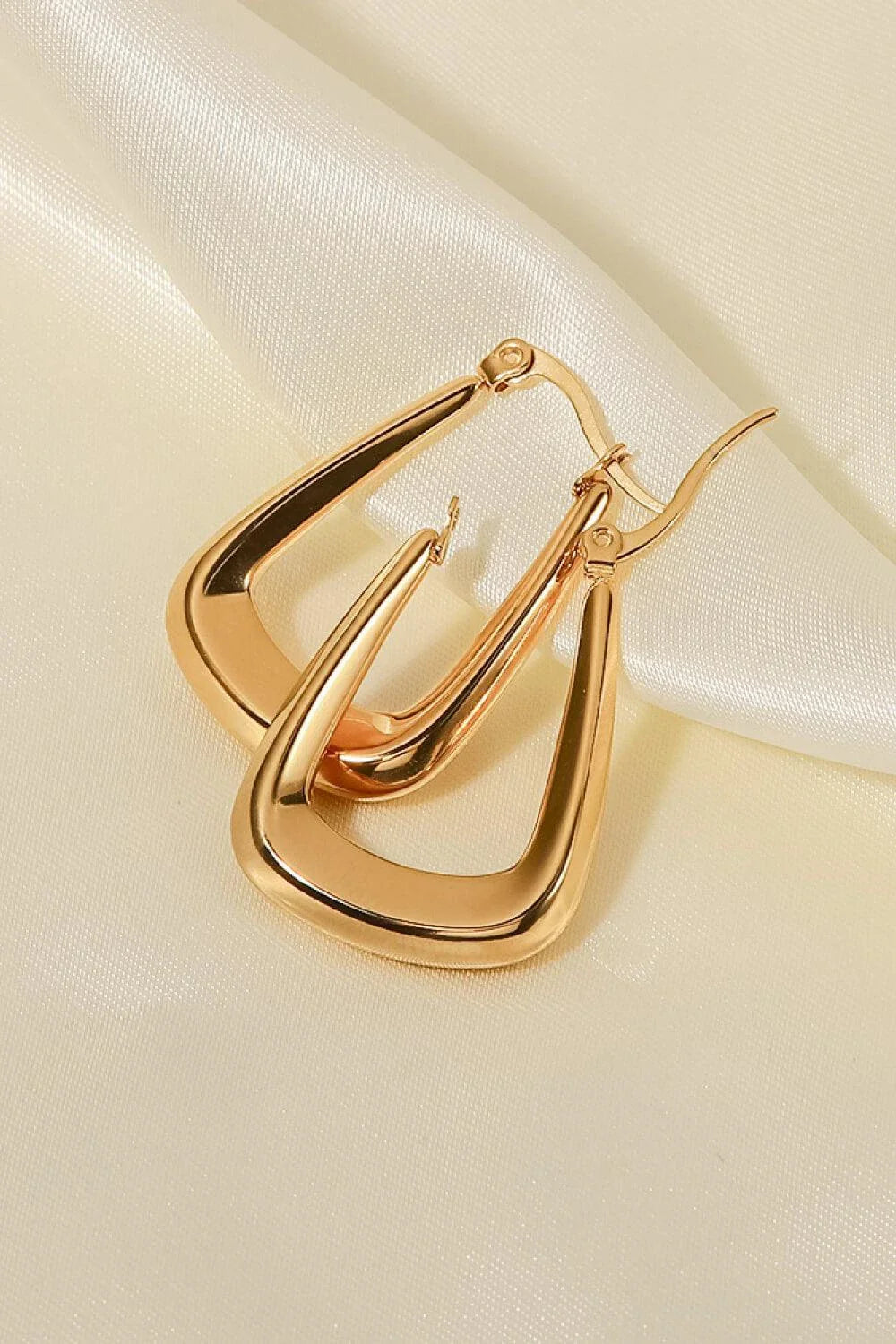 A pair of 18K gold-plated geometric earrings with a sleek and modern design