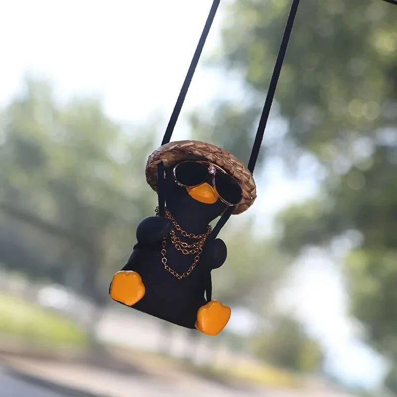 Charming swinging duck car accessory with guitar and coke-themed design, offering a unique and personalized driving experience