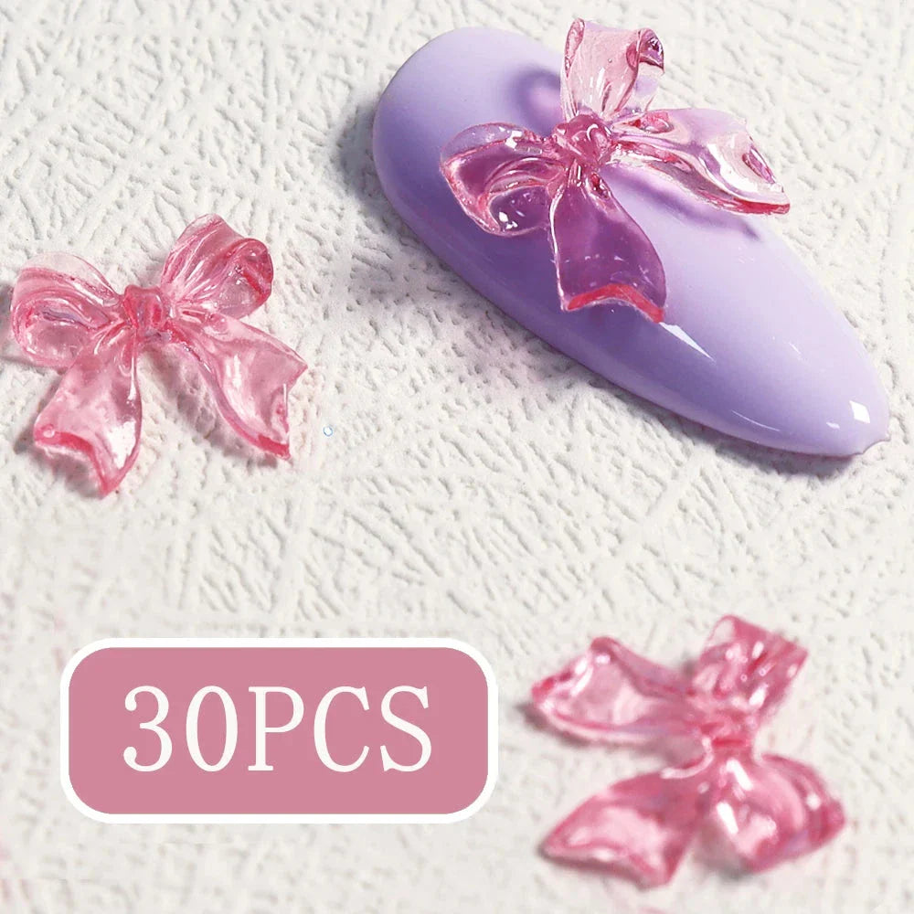 Charming candy-coloured bow nail charms in various colours, perfect for adding a playful touch to your manicure