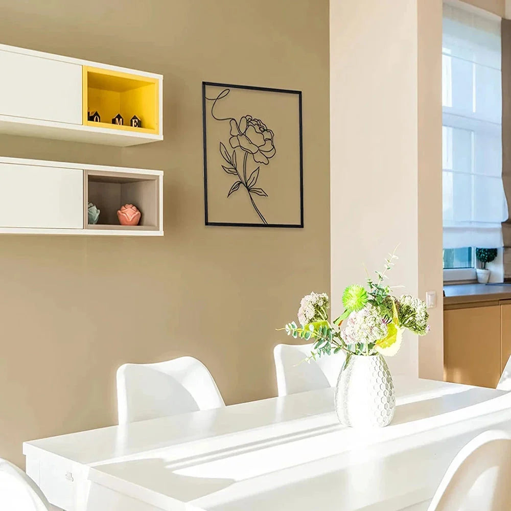 Abstract minimalist rose flower iron wall decor in black, featuring a sleek metal frame and elegant line painting