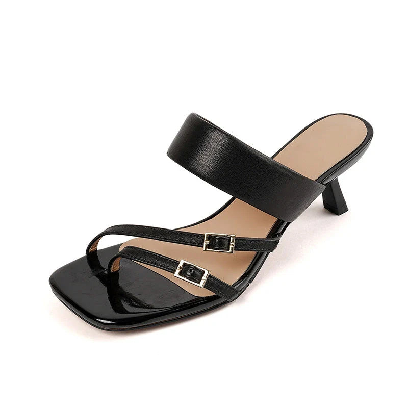 Elegant black genuine leather high heel open toe sandals with a sleek silhouette and chic buckle detail