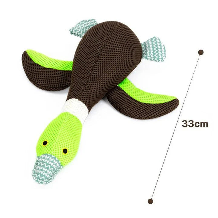 A soft, plush duck toy designed for dogs, featuring a squeaky component to encourage playful interaction.