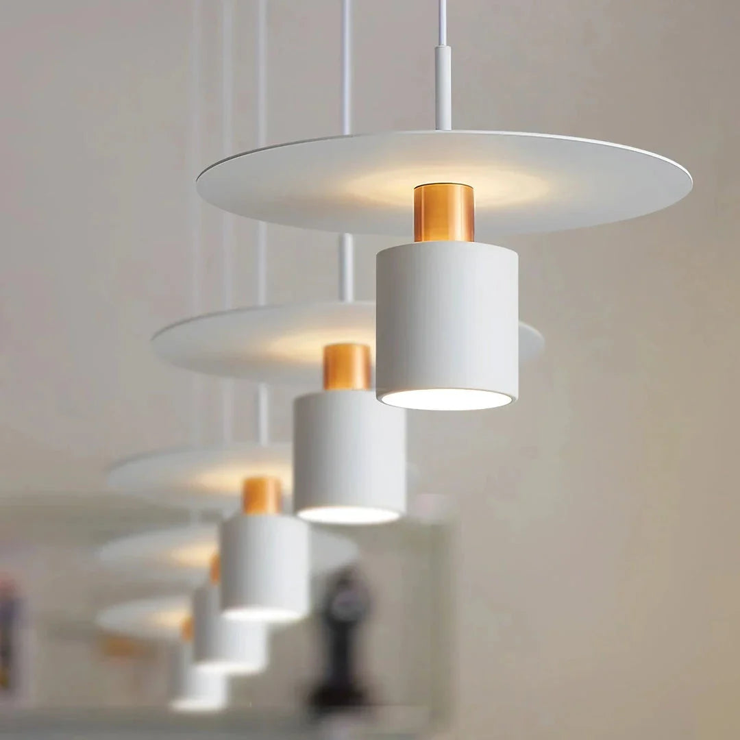 A modern and elegant minimalist pendant light made of durable metal with a smooth painted finish, providing focused and cosy illumination for a variety of interior spaces.