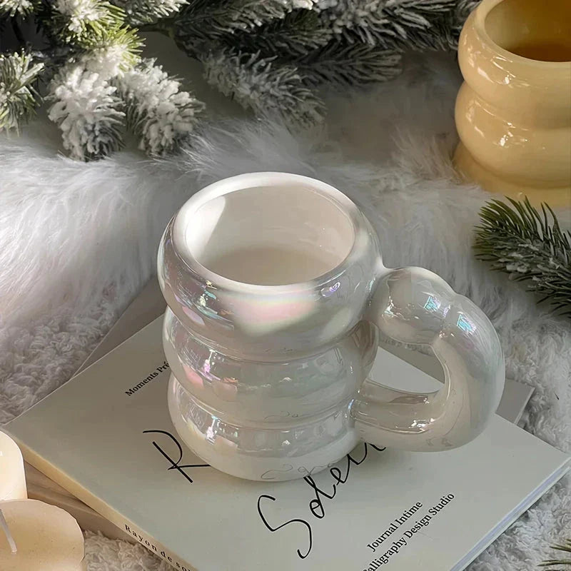 Charming ceramic coffee mug with a circular bubble design in a light blue colour, perfect for morning beverages in the UK