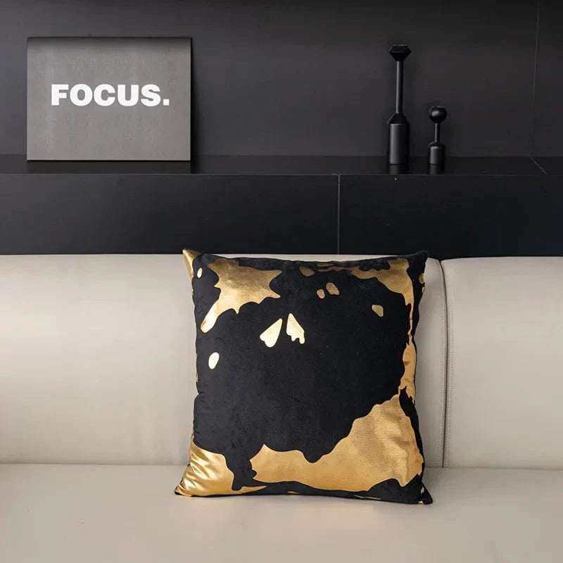 Pair of Nordic-inspired geometric plush pillowcases with a luxurious gold pattern on a white and black background