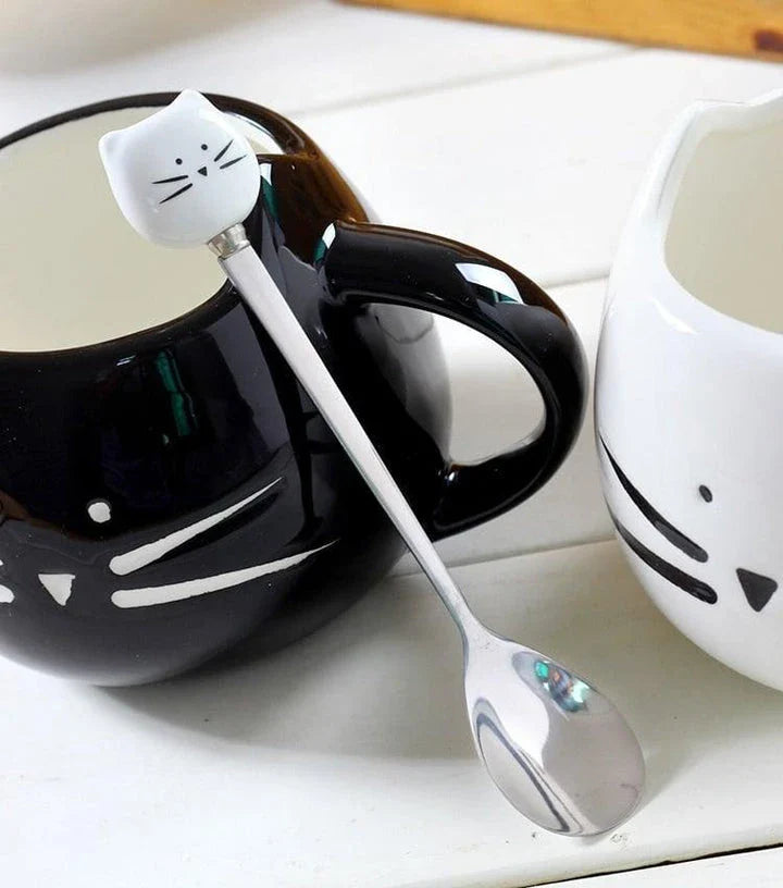 Charming black cat-shaped ceramic coffee mug with a spoon, a practical and whimsical addition to any coffee lover's collection