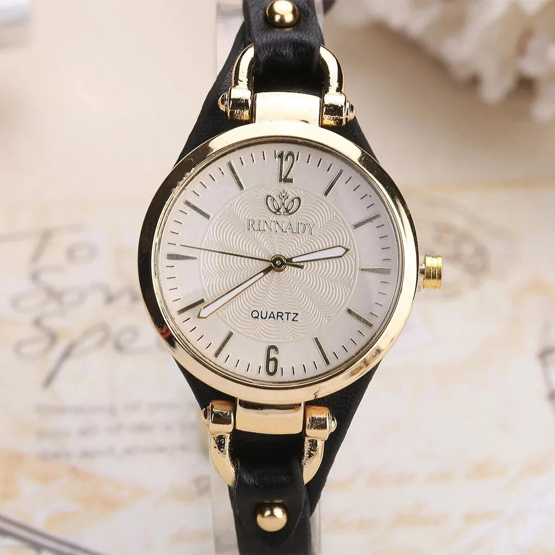 Elegant women's quartz watch with a black leather strap, featuring a sleek alloy case and a durable glass dial window