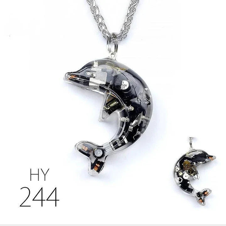 Steampunk-inspired dolphin pendant necklace with electronic components and brass accents