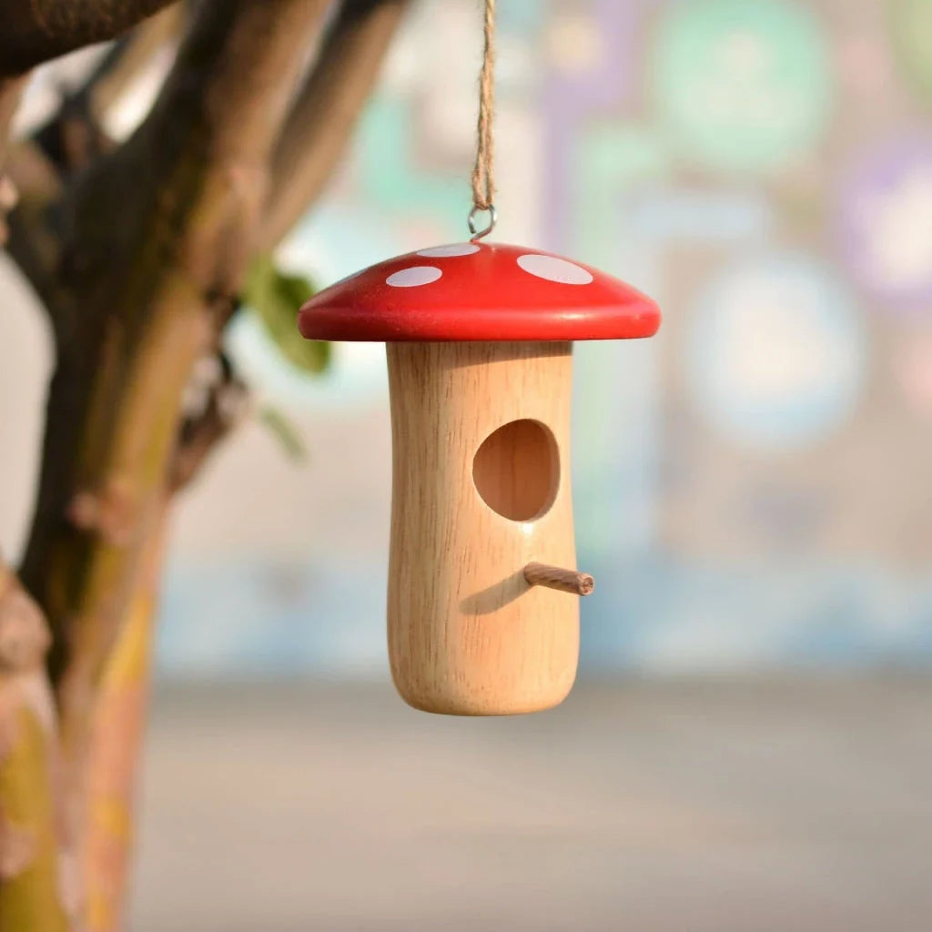 A charming wooden hummingbird nest designed for outdoor gardens, providing a safe and cozy home for these delightful birds.
