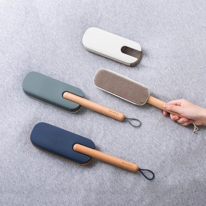Premium pet hair removal brush with grey handle and bristles, designed for use in UK homes