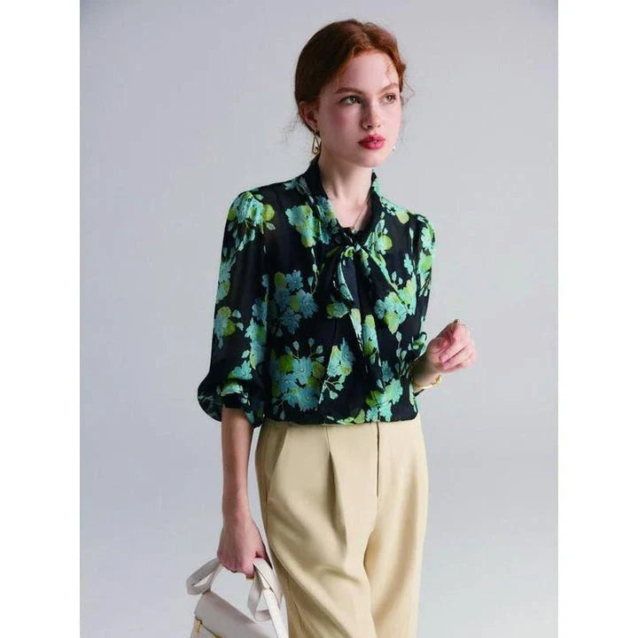 Elegant floral silk blend blouse for women featuring a bow collar, puff sleeves, and a flattering straight-cut silhouette