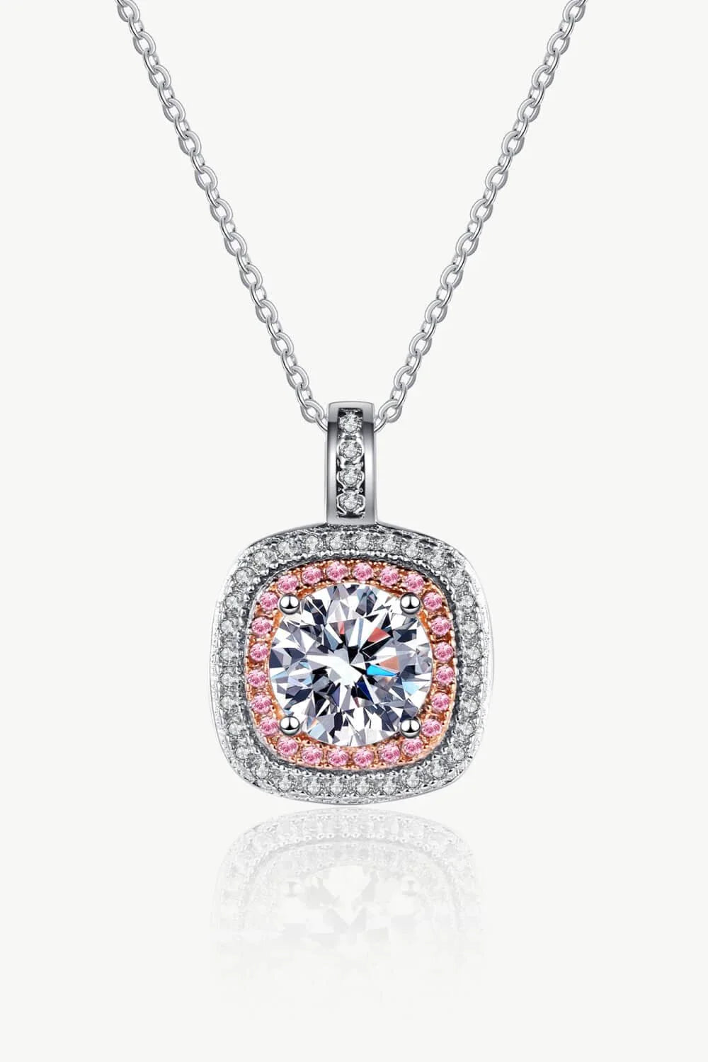 A rhodium-plated sterling silver necklace with a geometric pendant featuring a sparkling Moissanite gemstone over 0.3 carats.