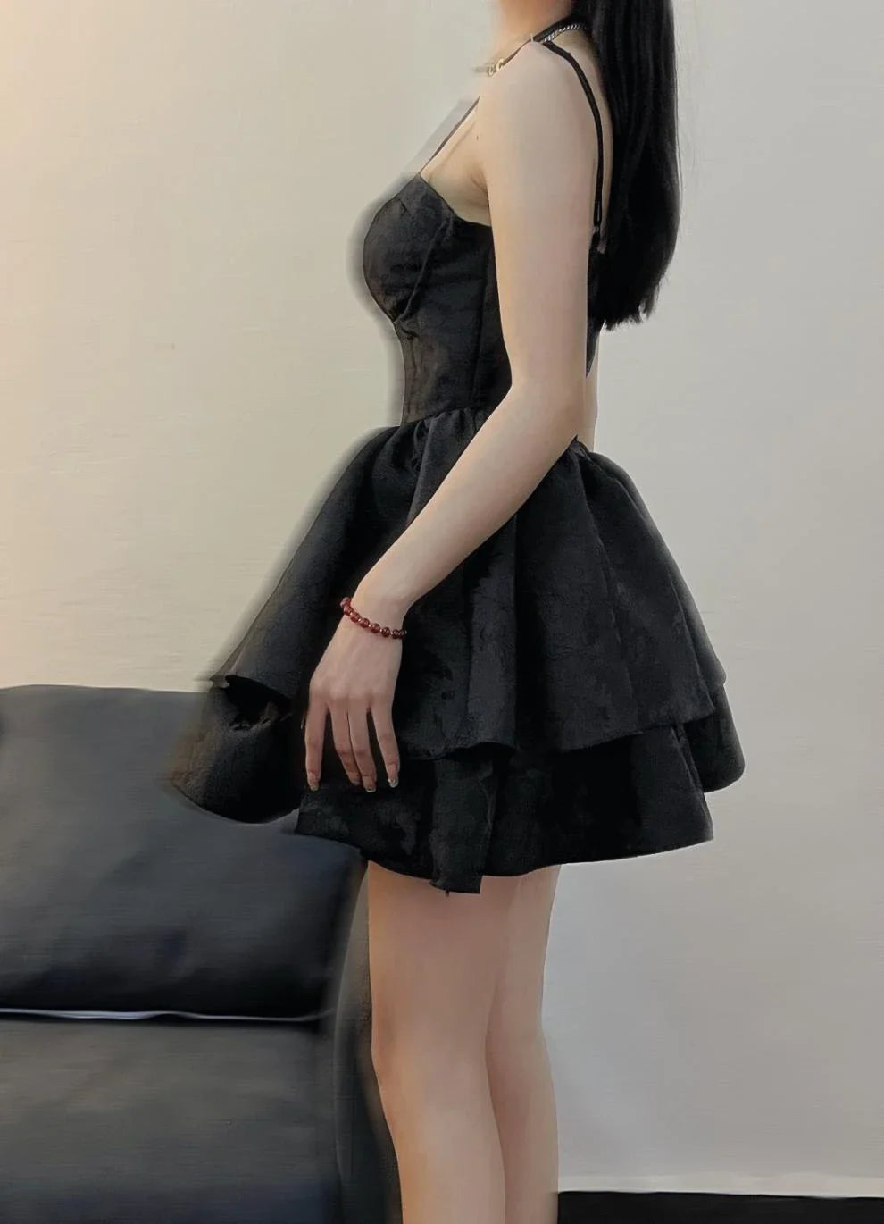 A stylish and elegant women's pettiskirt in a classic black colour, featuring a flowing A-line silhouette and premium polyester construction.