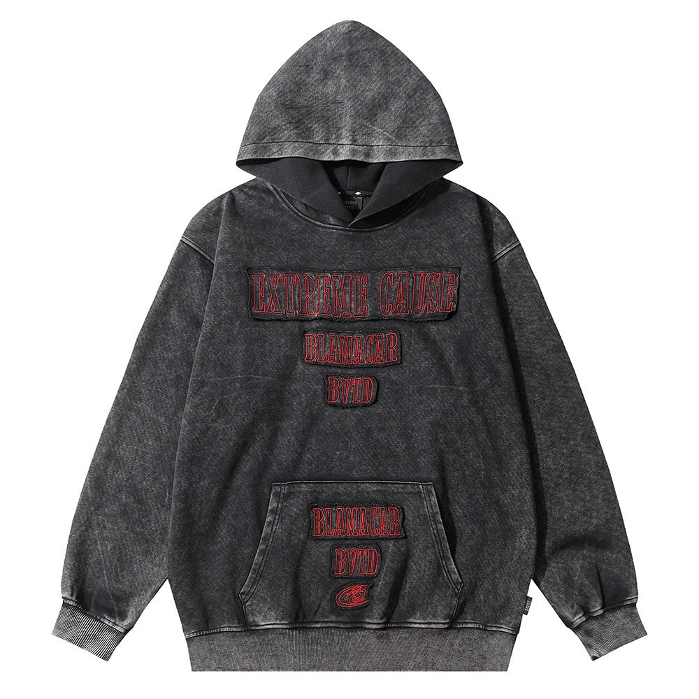 A premium cotton pullover hoodie with an embroidered letter patch in a variety of classic autumn colours