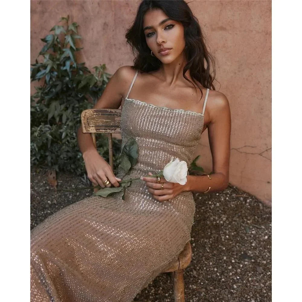 Elegant Sparkle Maxi Dress with spaghetti straps, backless design, and side split for a glamorous look