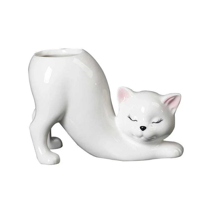 A charming cartoon cat-shaped flower pot made of high-quality glazed porcelain, perfect for adding a playful touch to your home or office decor.