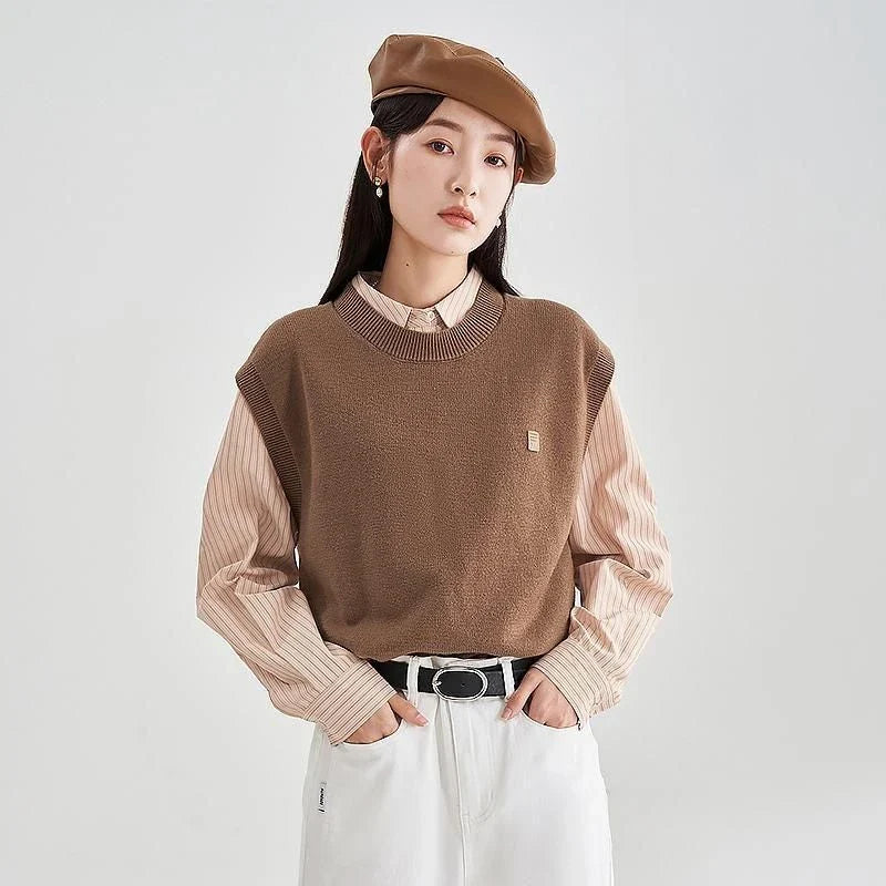 A cozy and chic knitted sleeveless vest in various colours, featuring a straight silhouette and a blend of premium materials for warmth and comfort.
