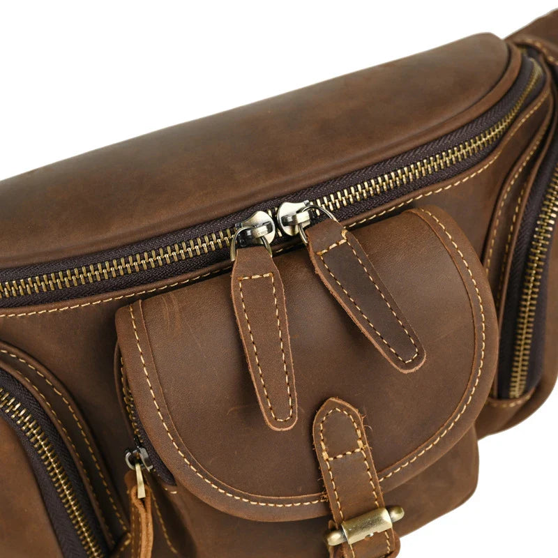 A classic leather satchel bag with a retro-inspired design, suitable for everyday use and commuting on a motorcycle.