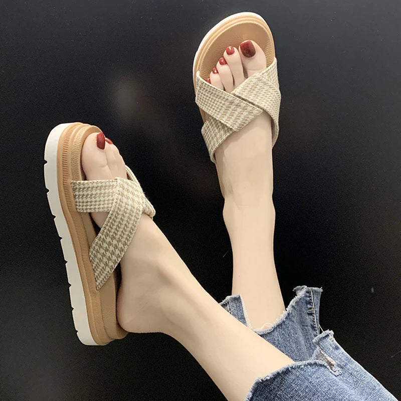 Comfortable and stylish herringbone slippers with a charming bow detail, perfect for indoor and light outdoor use.