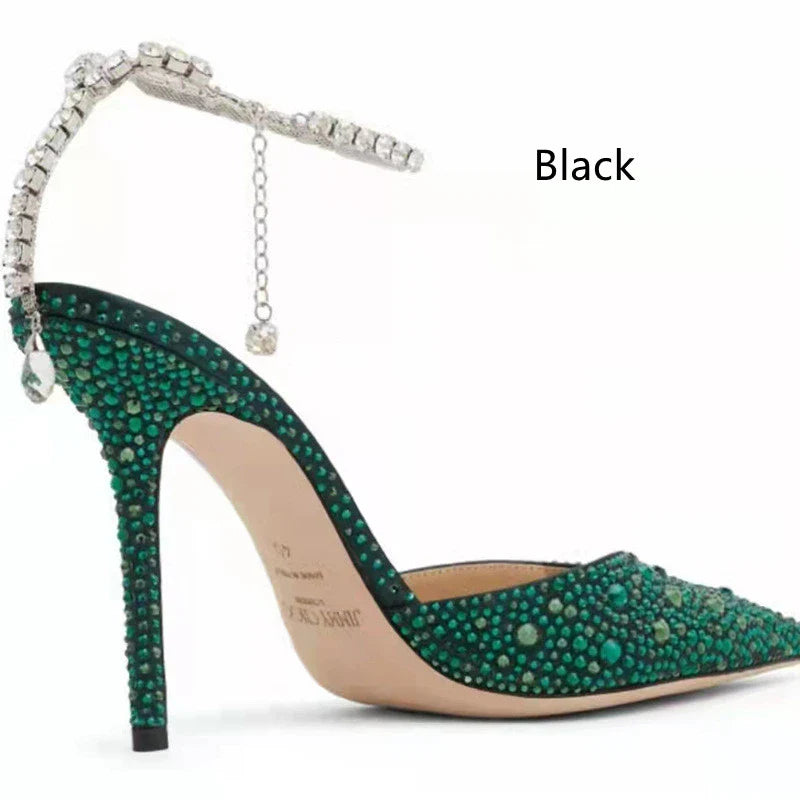 Elegant stiletto sandals with rhinestone chain embellishment, showcasing a sleek pointed toe design and matte finish for a sophisticated British-inspired look.