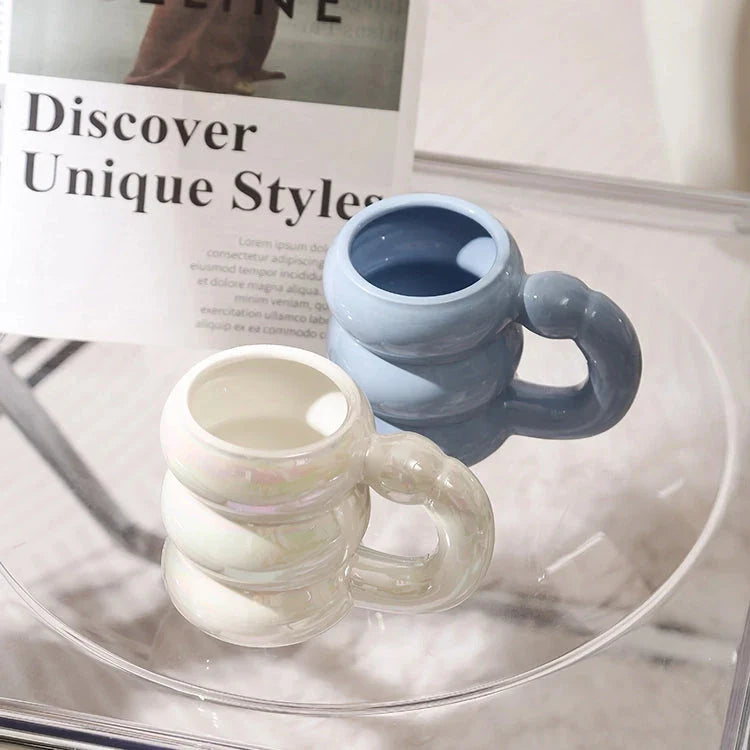 Charming ceramic coffee mug with a circular bubble design in a light blue colour, perfect for morning beverages in the UK
