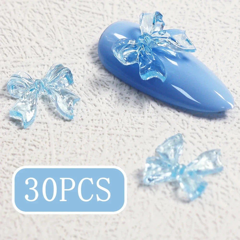 Charming candy-coloured bow nail charms in various colours, perfect for adding a playful touch to your manicure