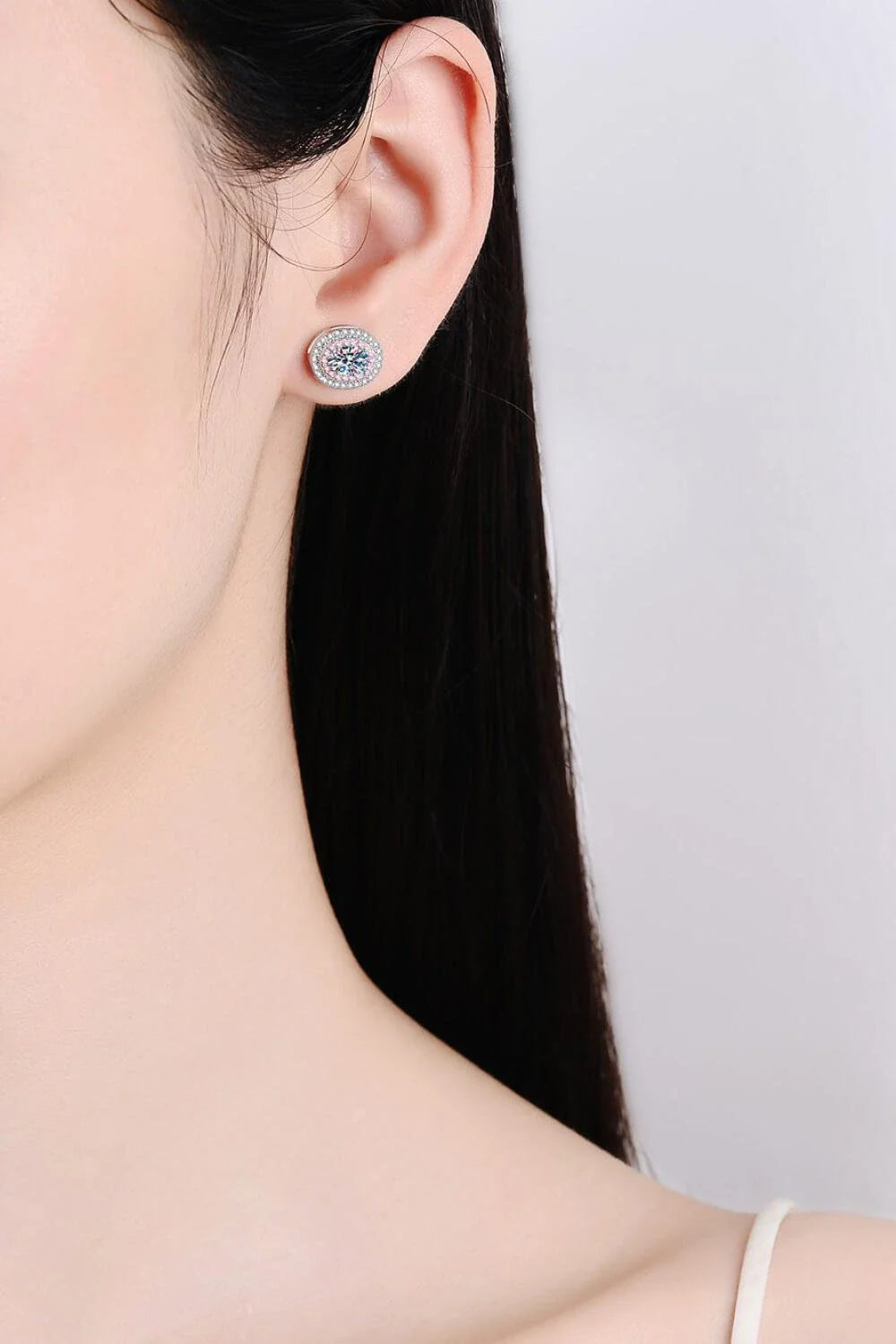 Elegant platinum-plated moissanite stud earrings with a minimalist design and sparkling stones