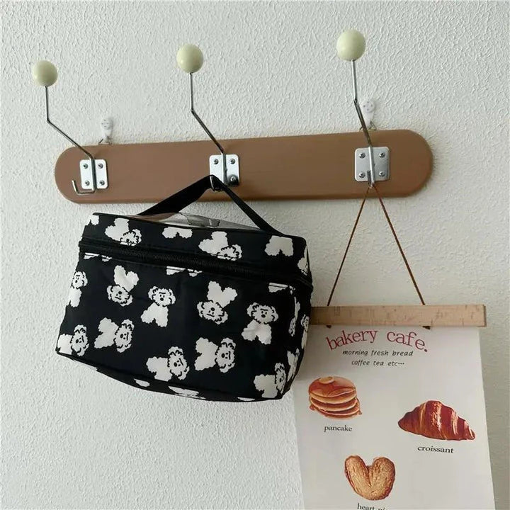 Cute dog-themed makeup bag with a playful design, made from durable cotton and PVC materials for practical and stylish organisation.