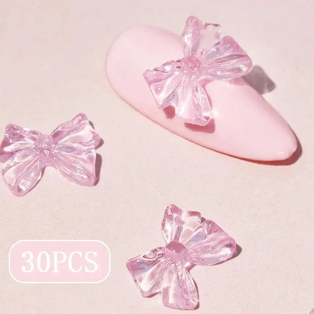 Charming candy-coloured bow nail charms in various colours, perfect for adding a playful touch to your manicure