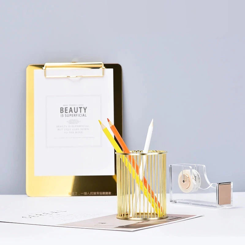 Rose gold plated pen holder with a sleek, minimalist design for organising pens, makeup brushes, and other desk accessories