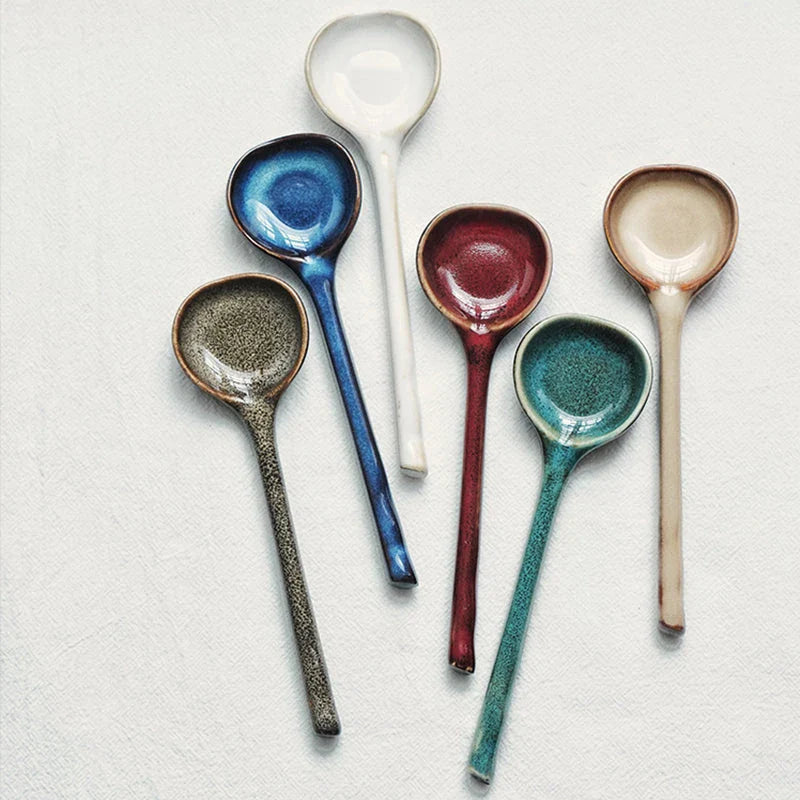 Elegant British ceramic soup spoon with long handle and vibrant glaze for refined dining experience