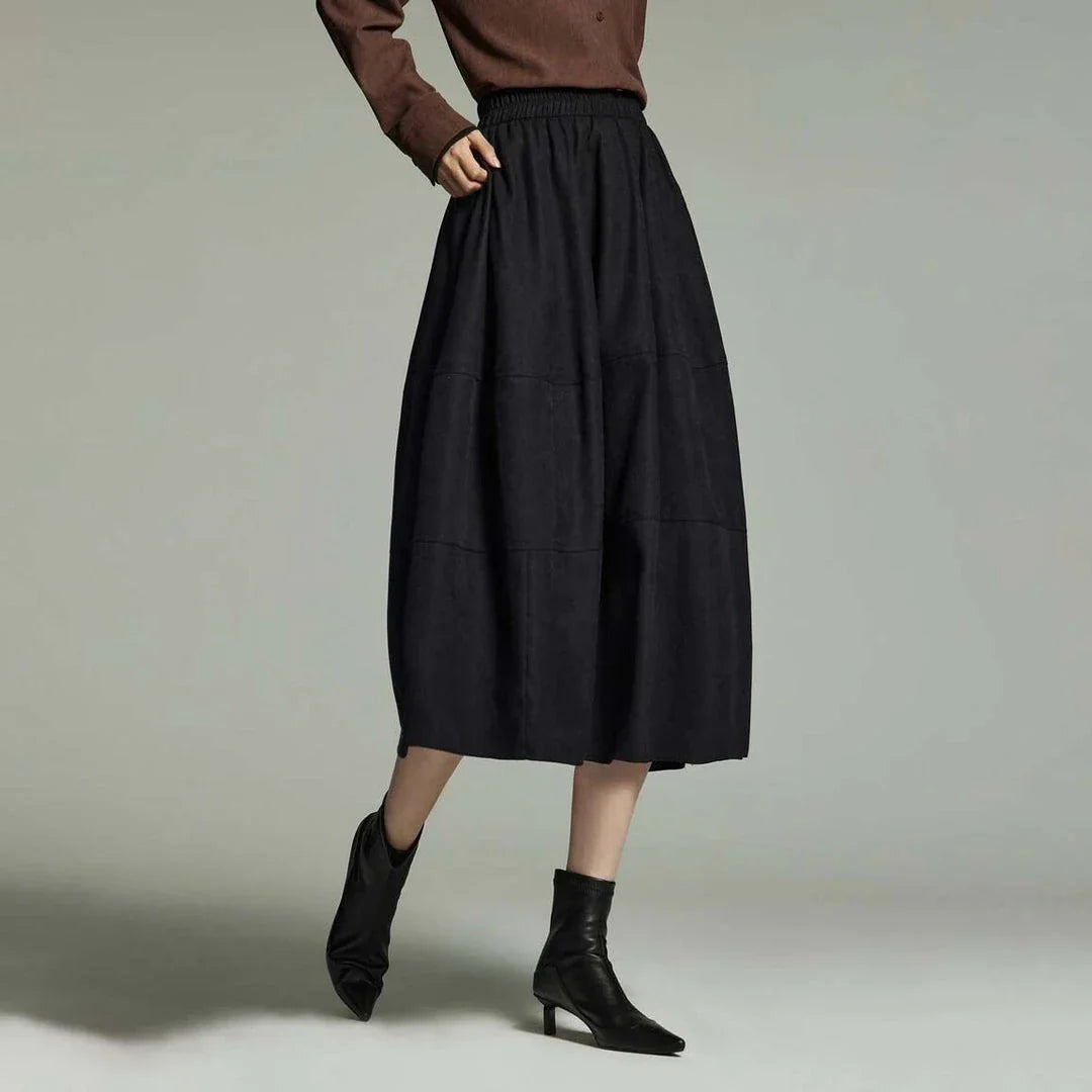 A stylish and sophisticated mid-length A-line pleated skirt with pockets, crafted from high-quality twill fabric for durability and comfort.