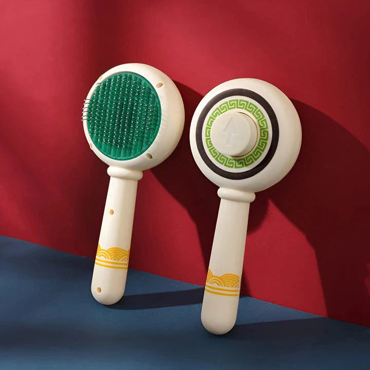 One-Click Pet Hair Removal Comb in red colour, designed to effectively remove loose fur and tangles from cat or dog coats