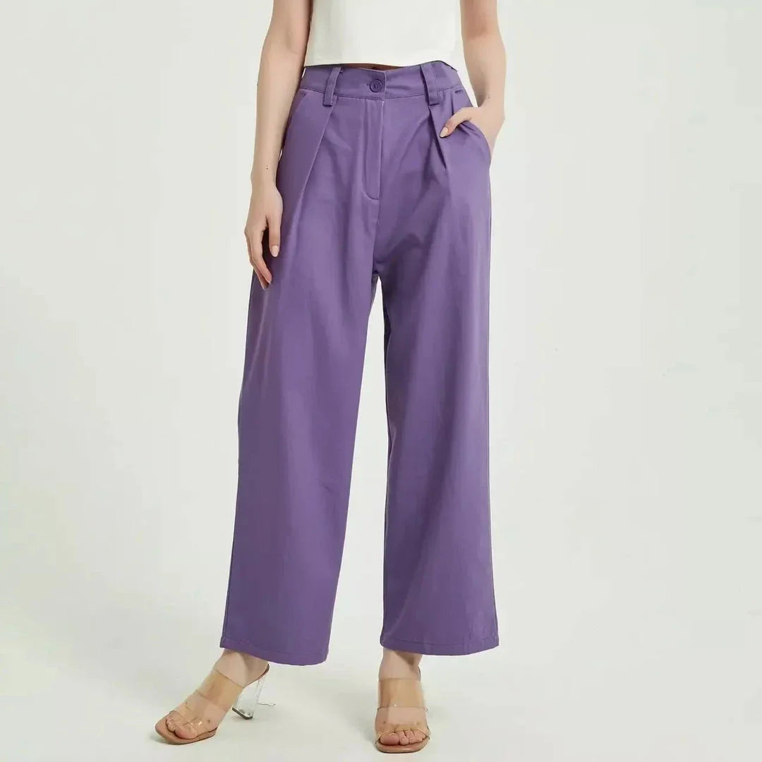 Elegant purple high-waisted wide-leg trousers with a vintage-inspired design, perfect for the modern British woman
