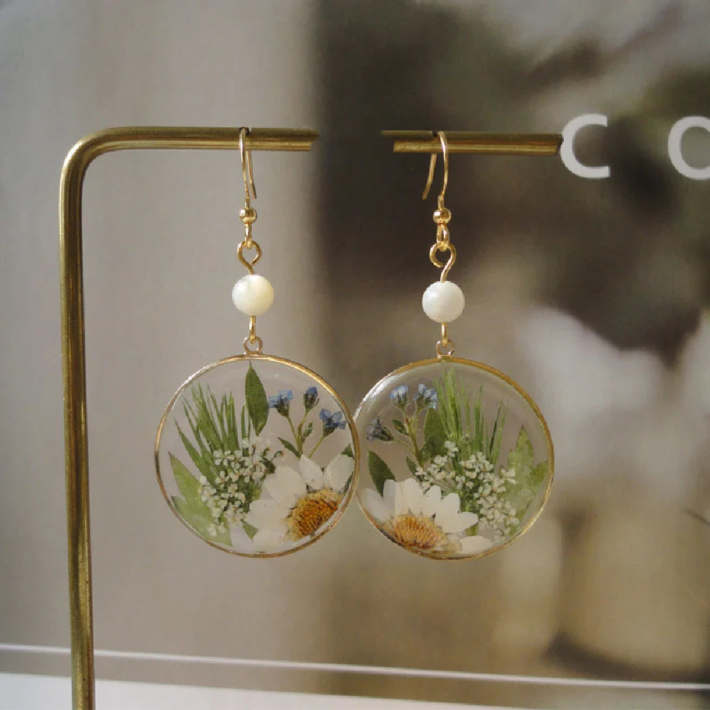 Elegant natural floral earrings with dried flowers and copper gilding, embodying British style and sophistication