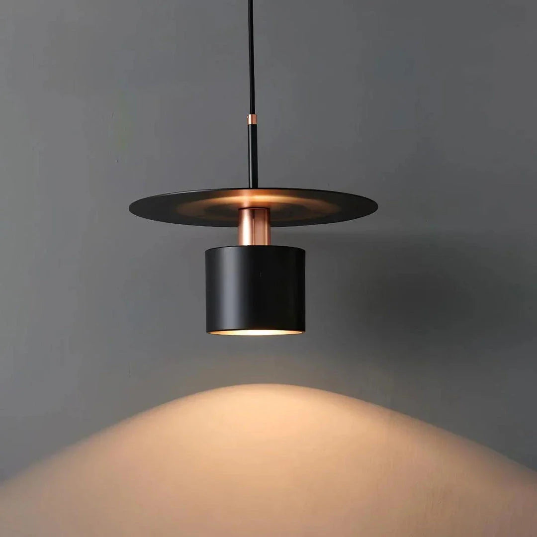 A modern and elegant minimalist pendant light made of durable metal with a smooth painted finish, providing focused and cosy illumination for a variety of interior spaces.
