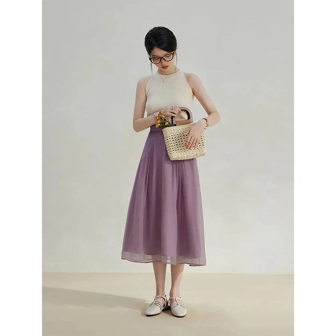 Elegant high-waist a-line midi skirt in a solid, vibrant colour for professional and social wear
