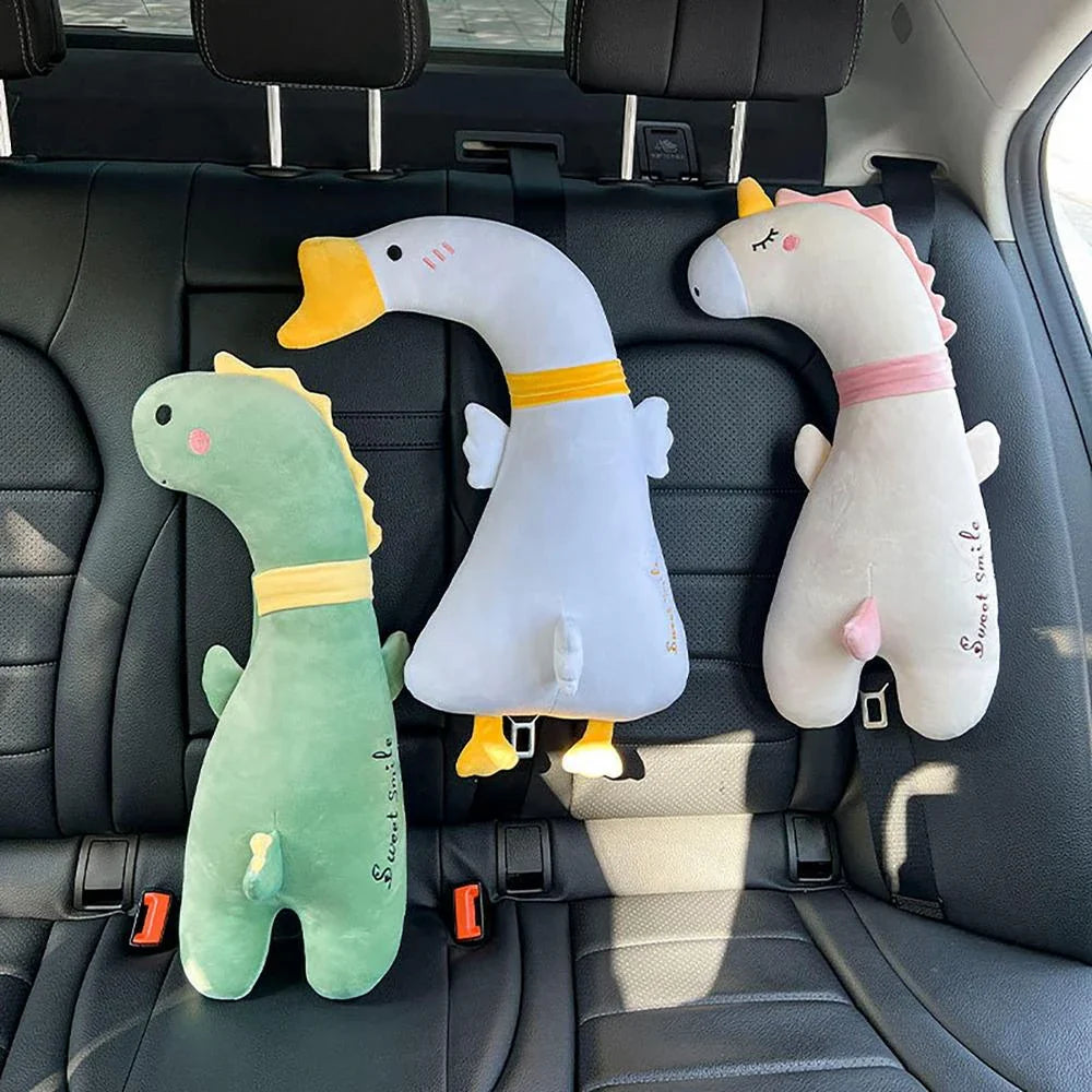 Comfortable car seat belt cushion pads with soft, breathable polyester fabric and plush PP cotton filling in fun cartoon designs including a giant goose, pink dinosaur, long-necked green dragon, and yellow giraffe