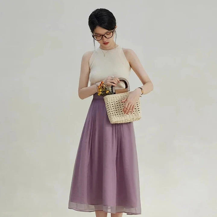 Elegant high-waist a-line midi skirt in a solid, vibrant colour for professional and social wear