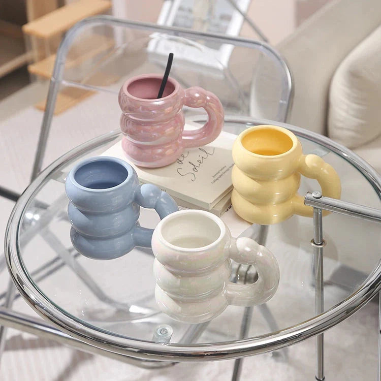 Charming ceramic coffee mug with a circular bubble design in a light blue colour, perfect for morning beverages in the UK