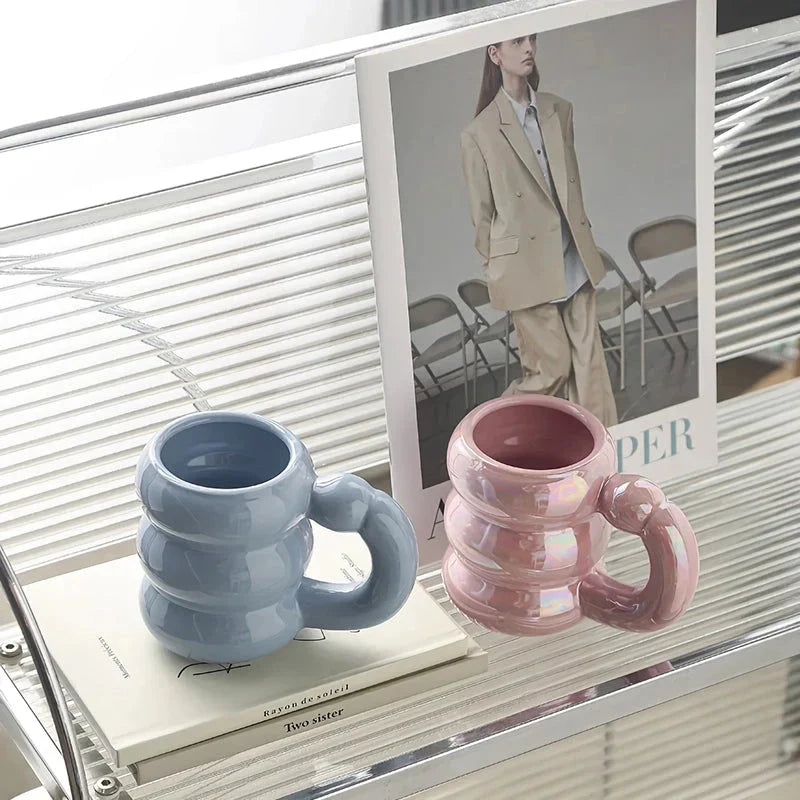 Charming ceramic coffee mug with a circular bubble design in a light blue colour, perfect for morning beverages in the UK