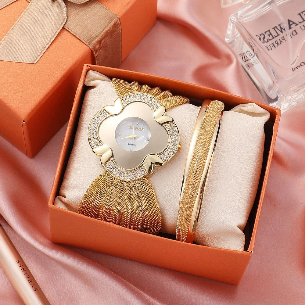 Elegant women's wrist watch with a floral dial design and a gleaming gold and silver mesh strap